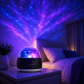 Galaxy projector lamp creating starry night bedroom decor