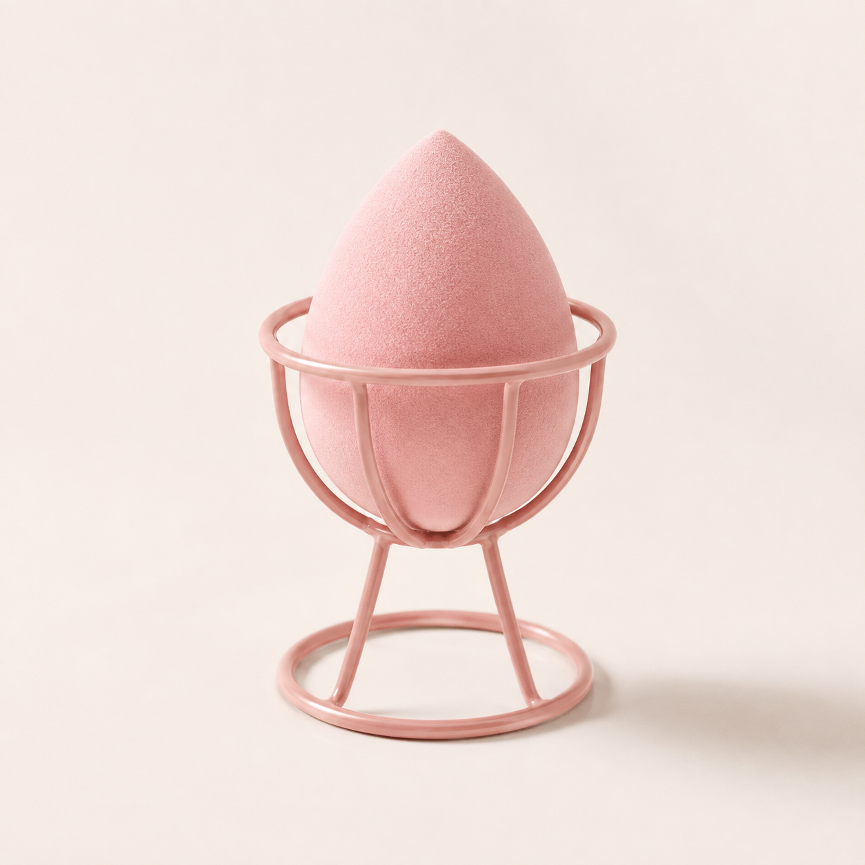 Pink makeup sponge inside a ventilated rose-shaped holder